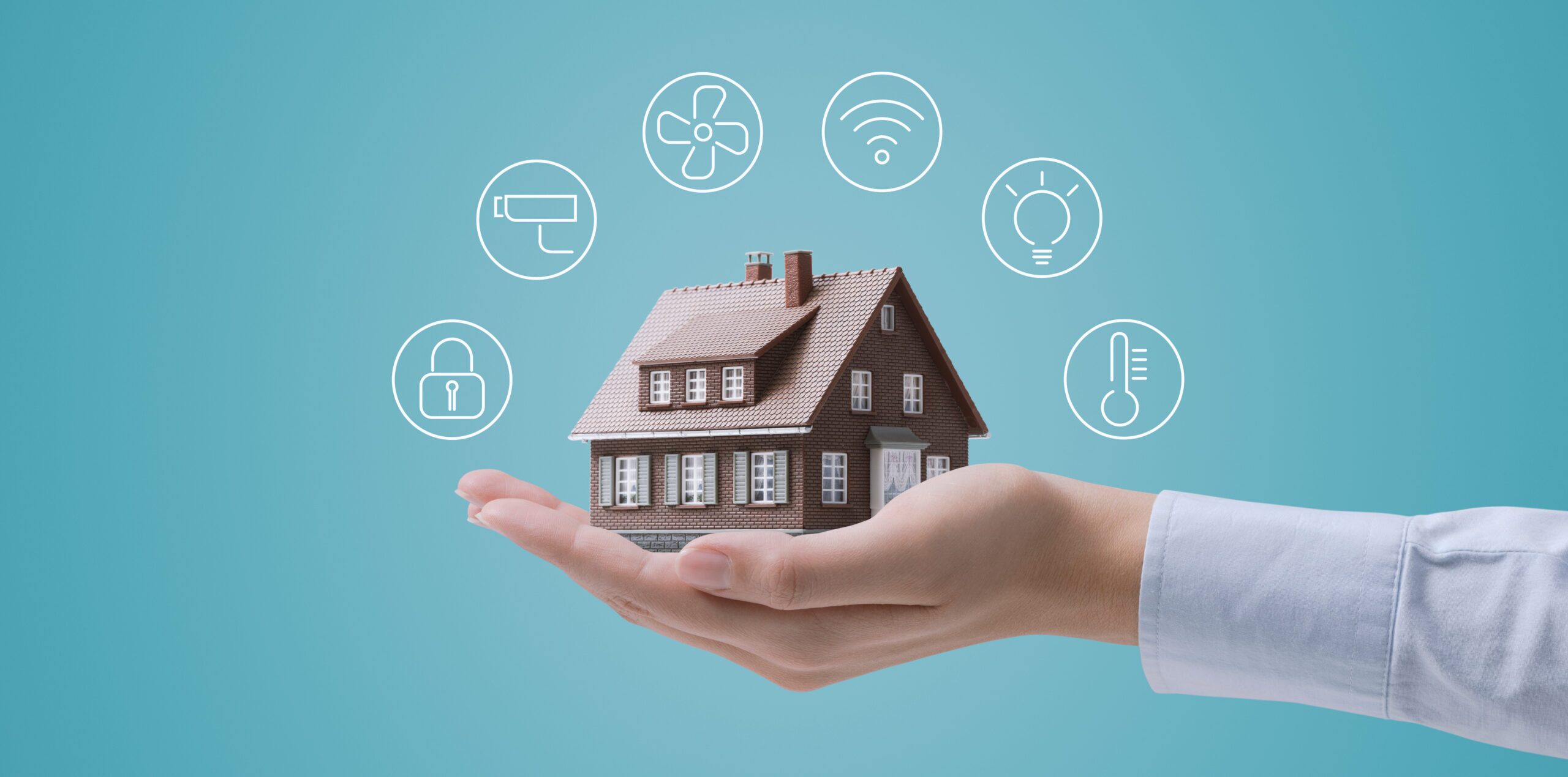 Hands holding a smart home model