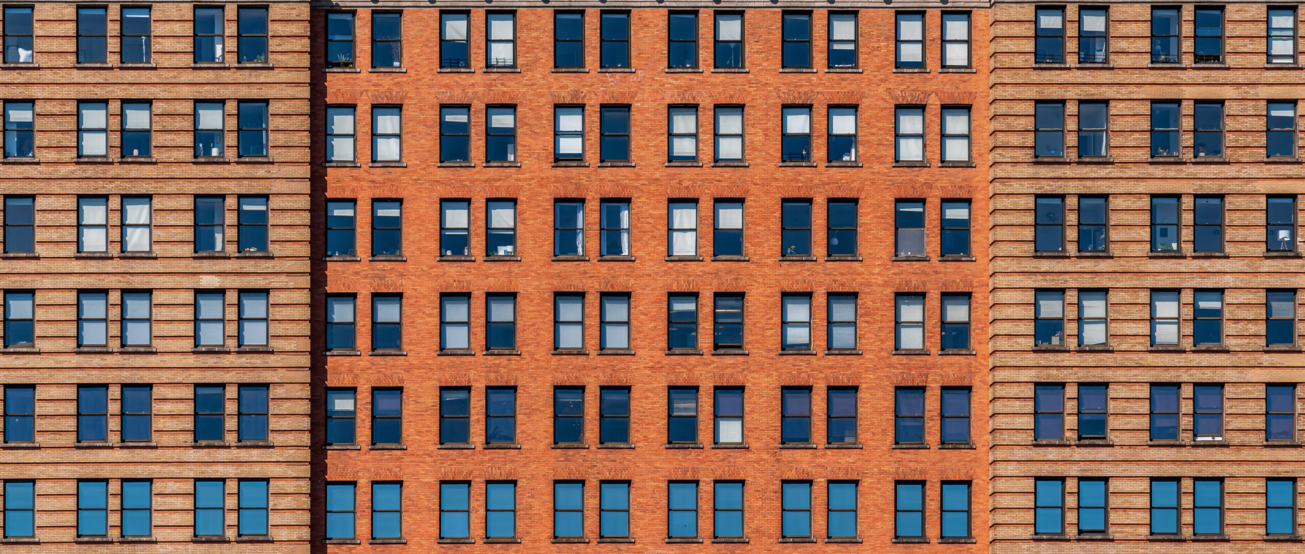 Banner and cover scene of Brown Brick high building facade