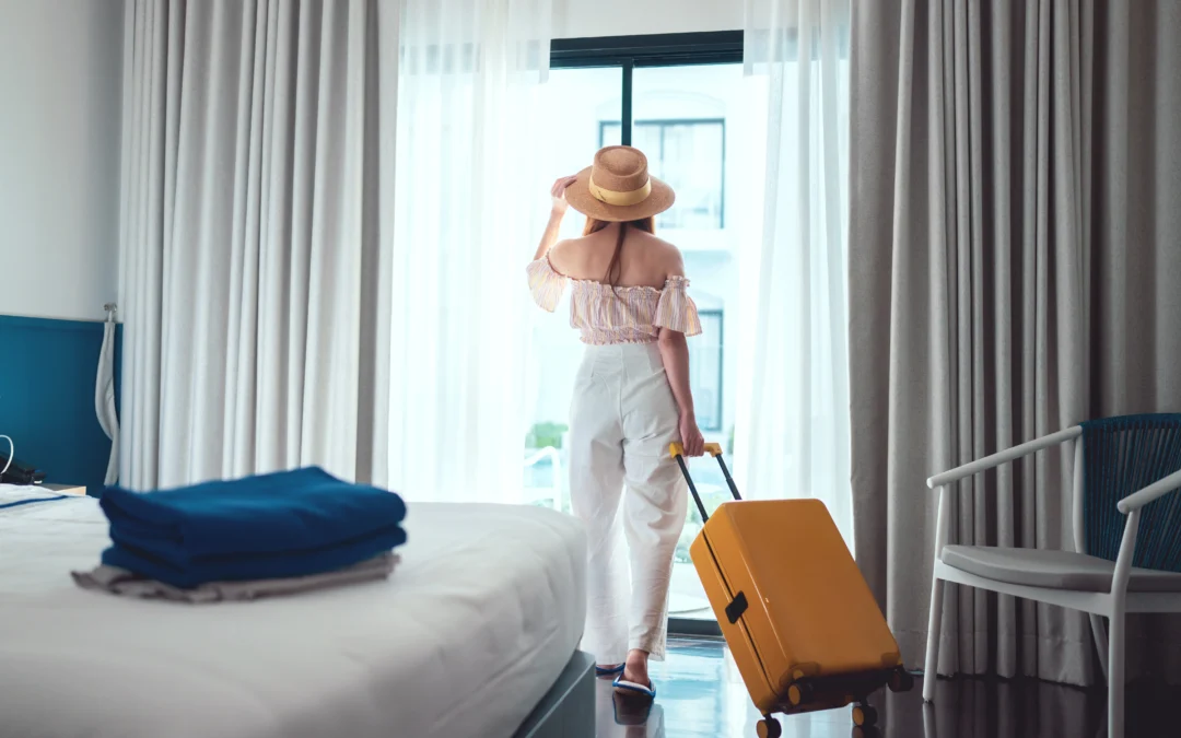 A guest walking into room where Verdant smart thermostat for hotels is installed.